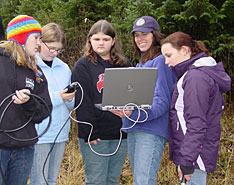 Kristen Romanoff and a group of students track a collared black bear