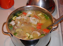 Halibut soup simmering on the stove