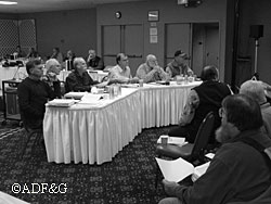 Board members listen to testimony at a Board of Game meeting