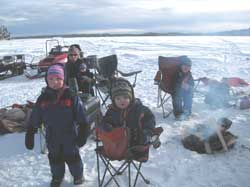 Tipup fishing for burbot with 3 families