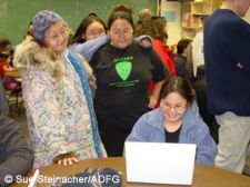 Michelle Lincoln demonstrates the computer show she developed to interested members of the White Mountain community