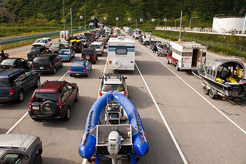 Vehicles waiting to pass through the Whittier Tunnel on the Portage Glacier Highway Photo by Milo Burcham