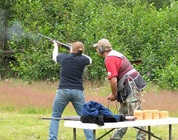 A participant in the Becoming an Outdoors Woman program learns to fire a shotgun in Juneau