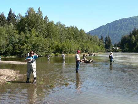 Participants in the ADFampGsponsored Alaskans Afield program learn to fly fish at the confluence of the Medenhall River and Montana Creek in Juneau Photo by Tennie Bentz