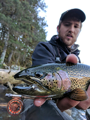The author with a coastal cutthroat trout
