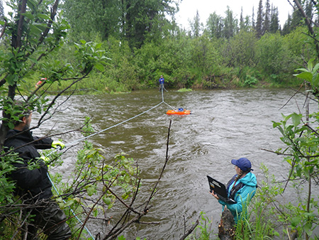 ADCP on a tethered trimaran boat which is towed across a river transect by scientists on either bank Photo Credit Instream Flow Program