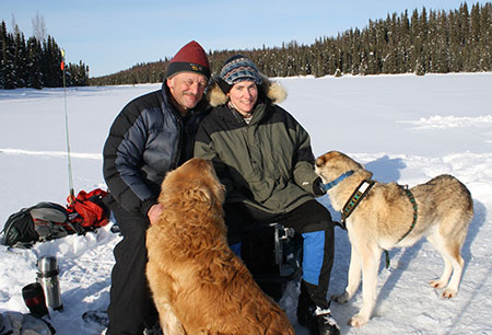 For Clark and Yvonne one of their first dates involved icefishing Here their dogs join the photo op on a remote lake north of Soldotna in 2012