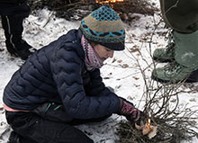 Starting a fire in an Alaskans Afield winter survival class
