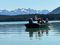 Figure 11. &mdash; Crew performing a zooplankton tow.