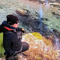 Figure 7. &mdash; An ADF&G technician counts adult coho salmon.