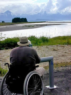 An accessible viewing scope in use at Eagle Beach